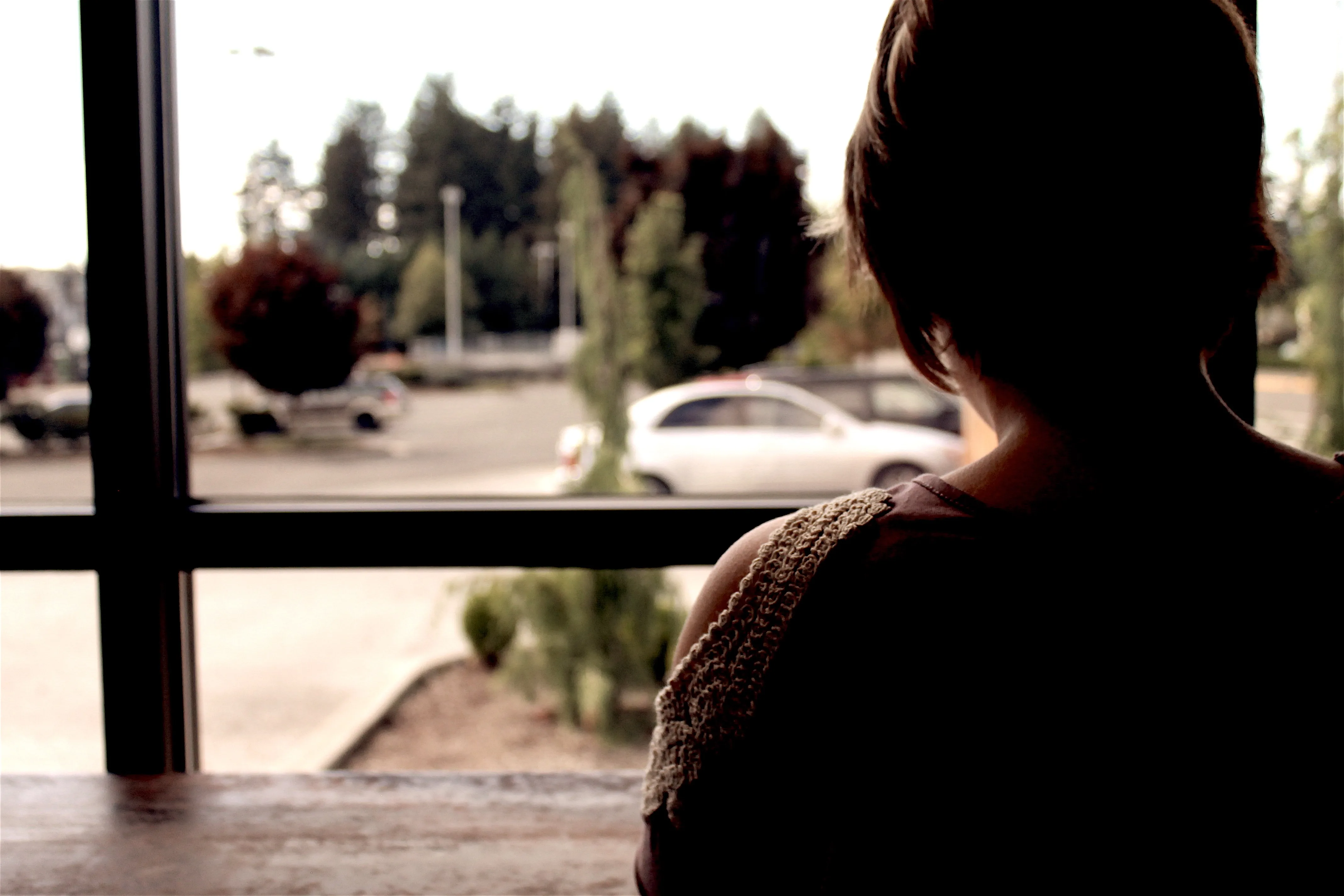 woman staring out window CREEP Act