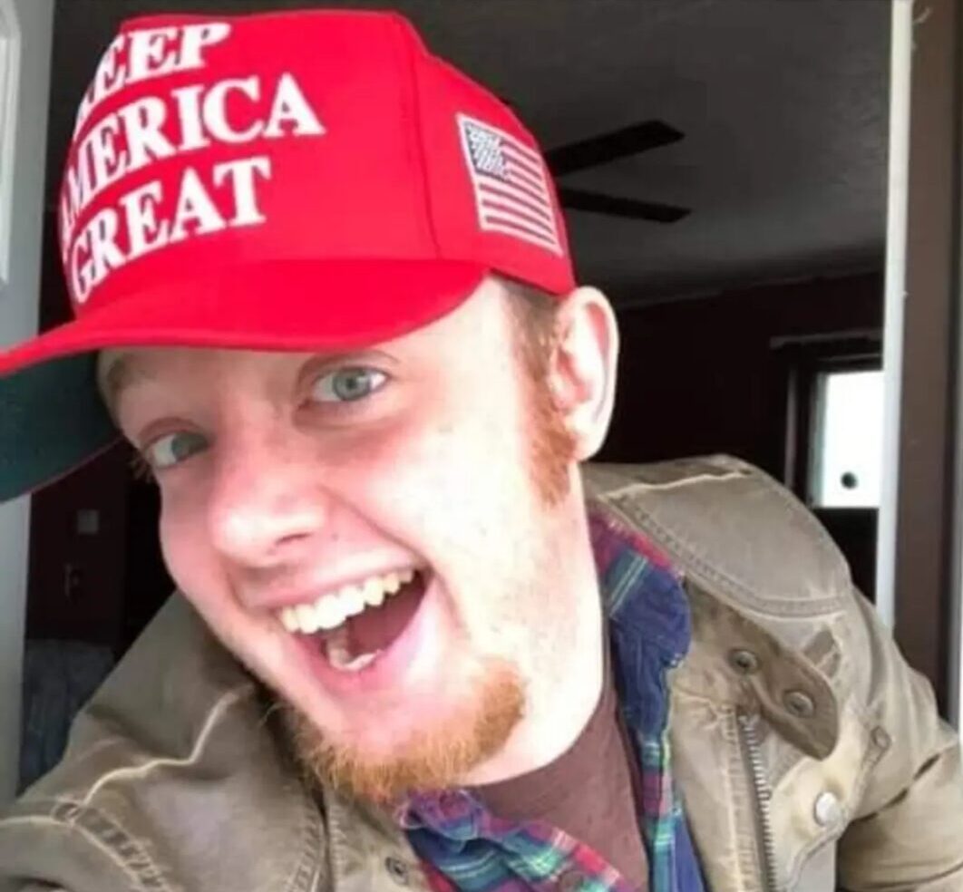 Luke Wenke keep america great red hat big smile jacket