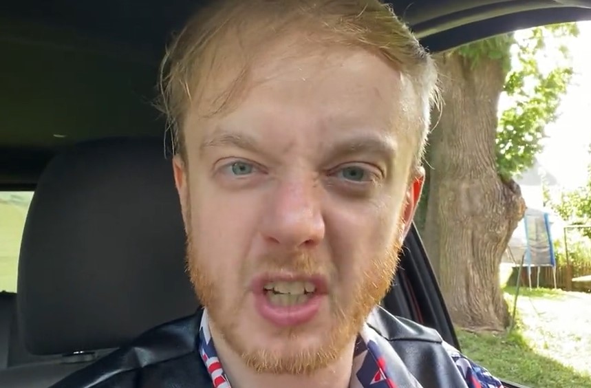 angry man luke wenke grimace receding hairline sitting in car